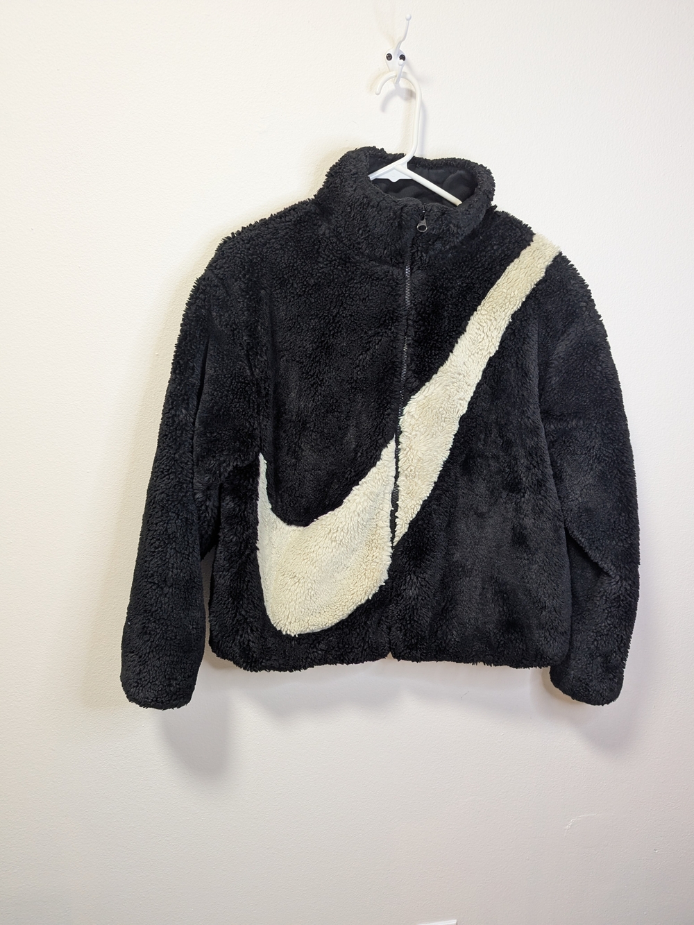 Nike Faux Fur Jacket in Black With White Swoosh